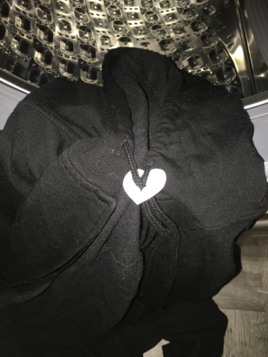 A black garment with a white heart-shaped detail in the center.